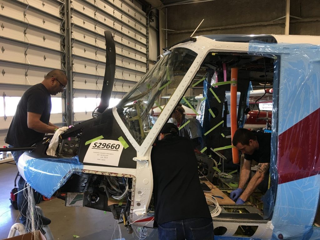 Maxcraft technicians working on various tasks in our hangar