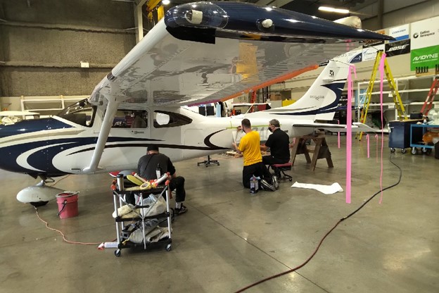 Maxcraft Technicians Installing the New Canadian Registration Decal