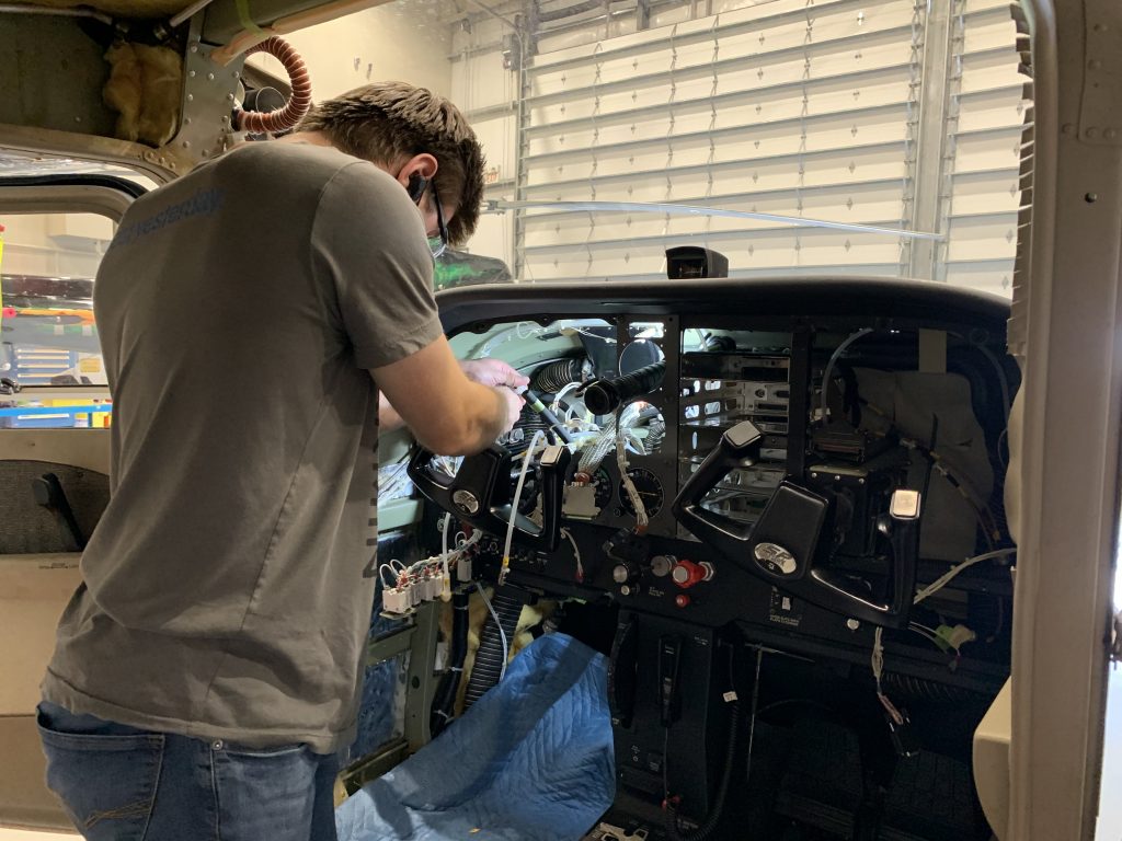 A Maxcraft Technician Working While the Panel is Disassembled