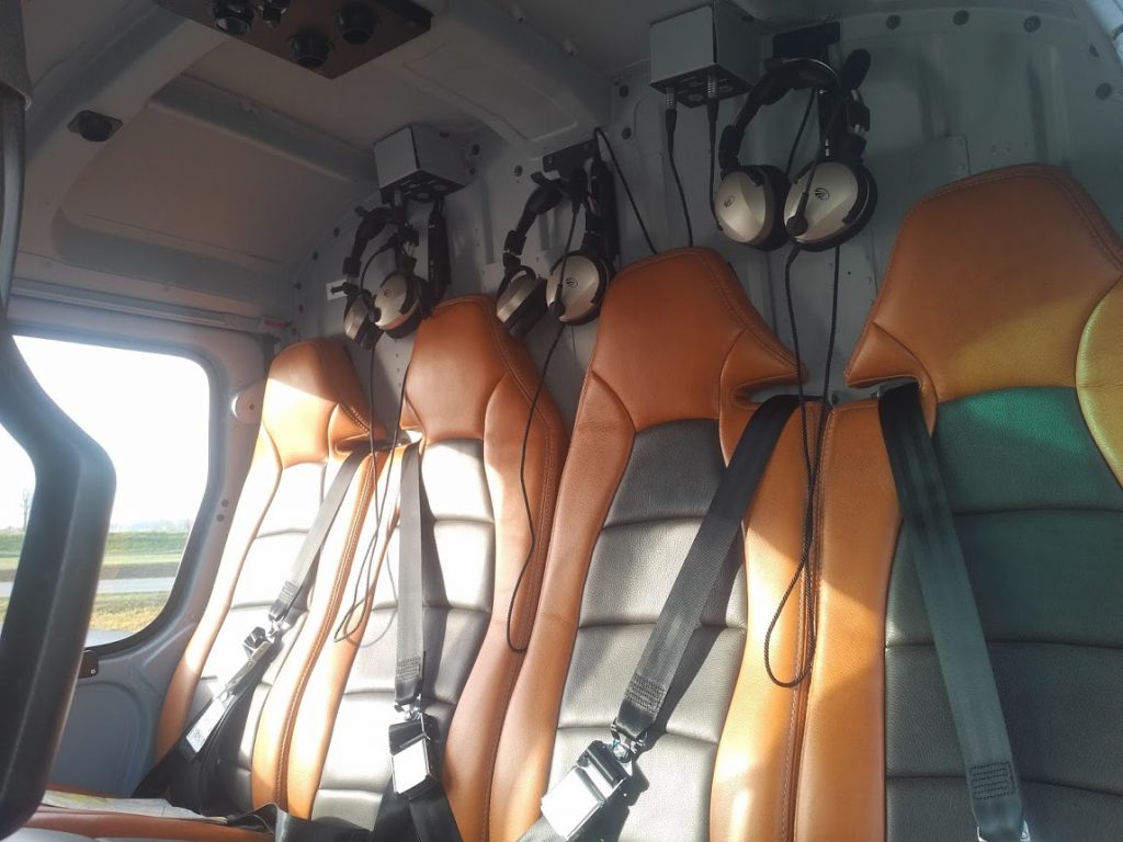 Lightspeed Headsets Mounted Above the Rear Seats