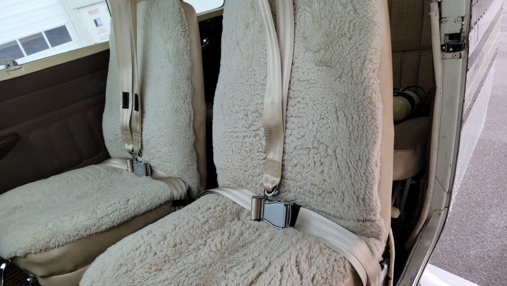 The Tan Seatbelts Match the Sheepskin Seat Covers
