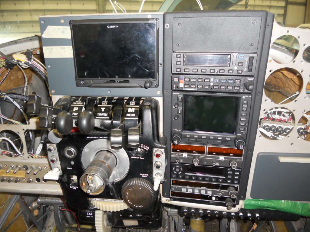 The G500 Engine Information System and Radio Stack Installed in the Panel