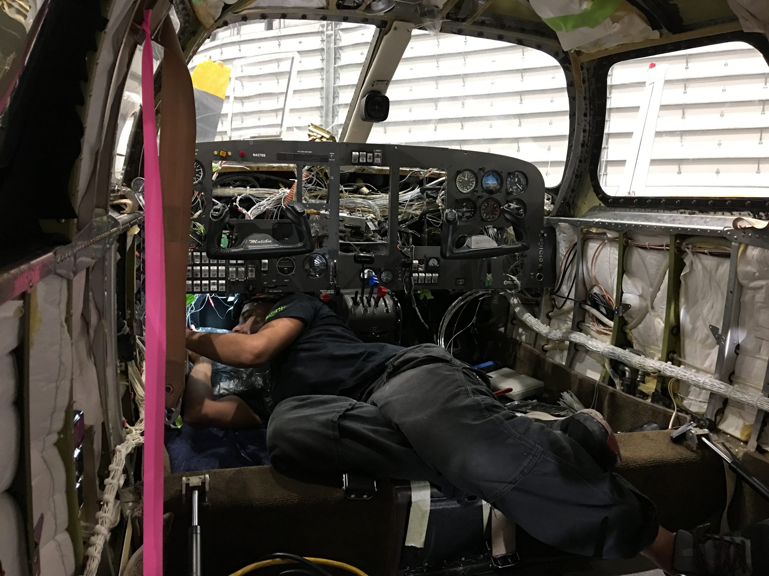 A Maxcraft Technician Fixing Incorrect Wiring Under the Panel