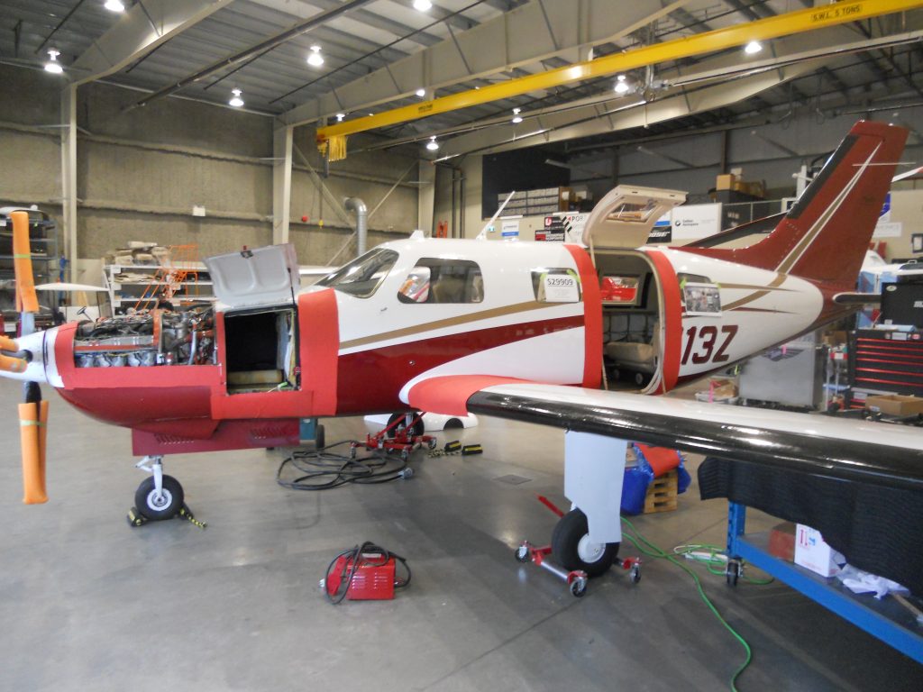 The Malibu in Our Hangar with Protective Coverings and The Cowling Removed to Install Engine Probes