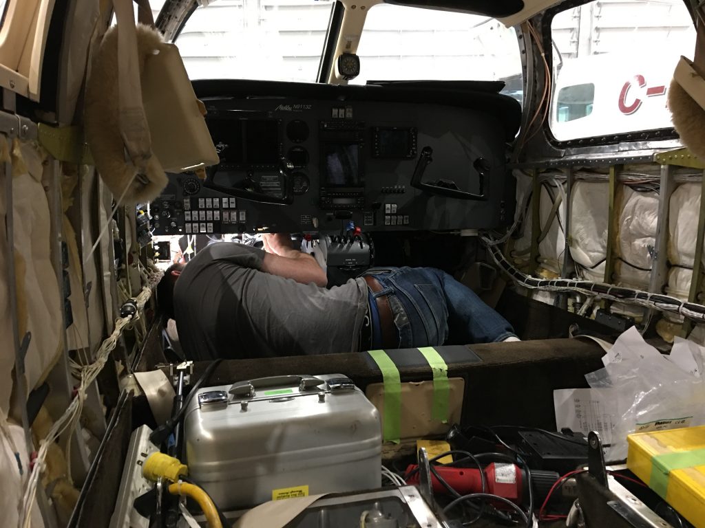 A Maxcraft Technician Works Under the Panel