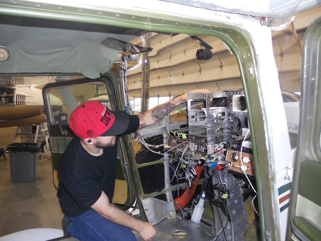 A Maxcraft Technician Test Fitting the Radio Rack