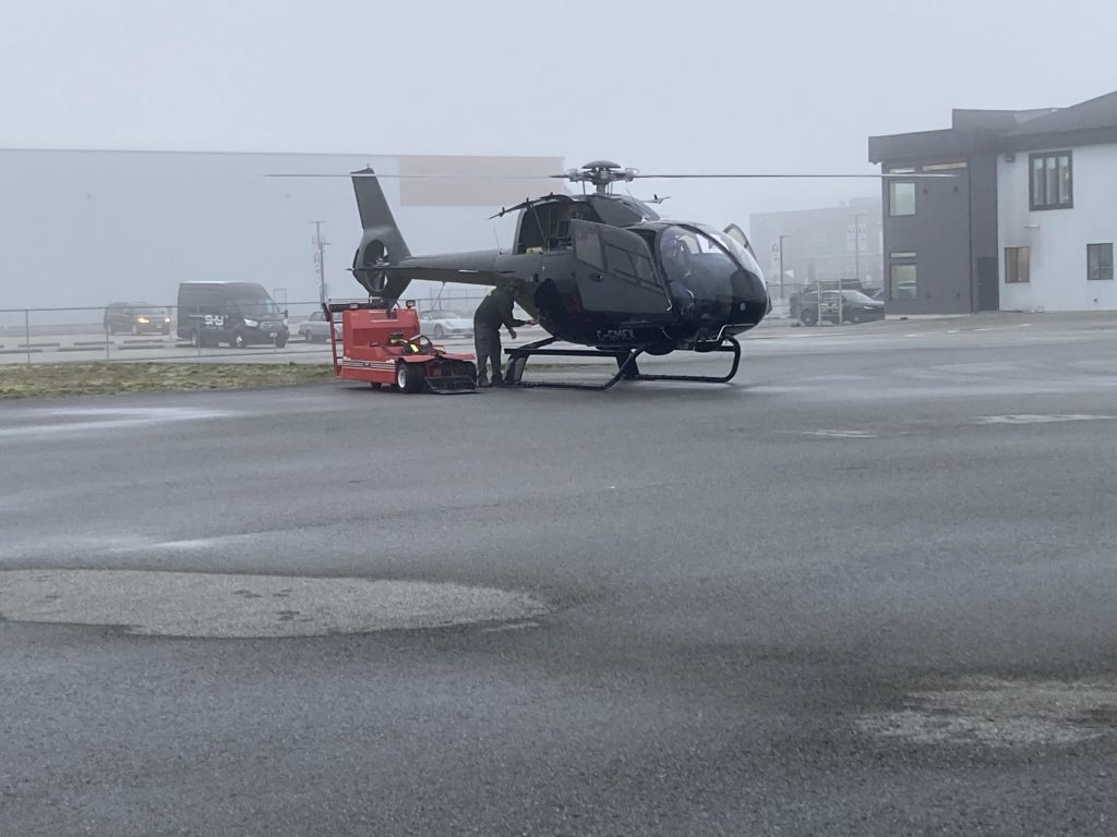 The EC120B Undergoing Maintenance on a Foggy Day Prior to Flight Testing