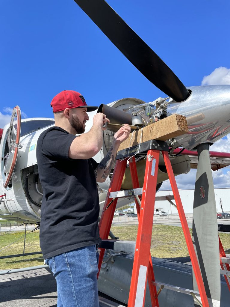 A Maxcraft Technician Installing Engine Information System Probes