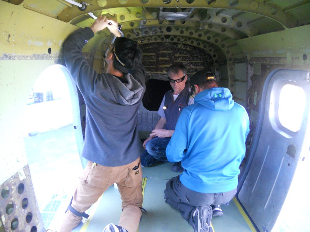 Three Maxcraft Technicians Busy at Work in the Rear of the Turbo Otter