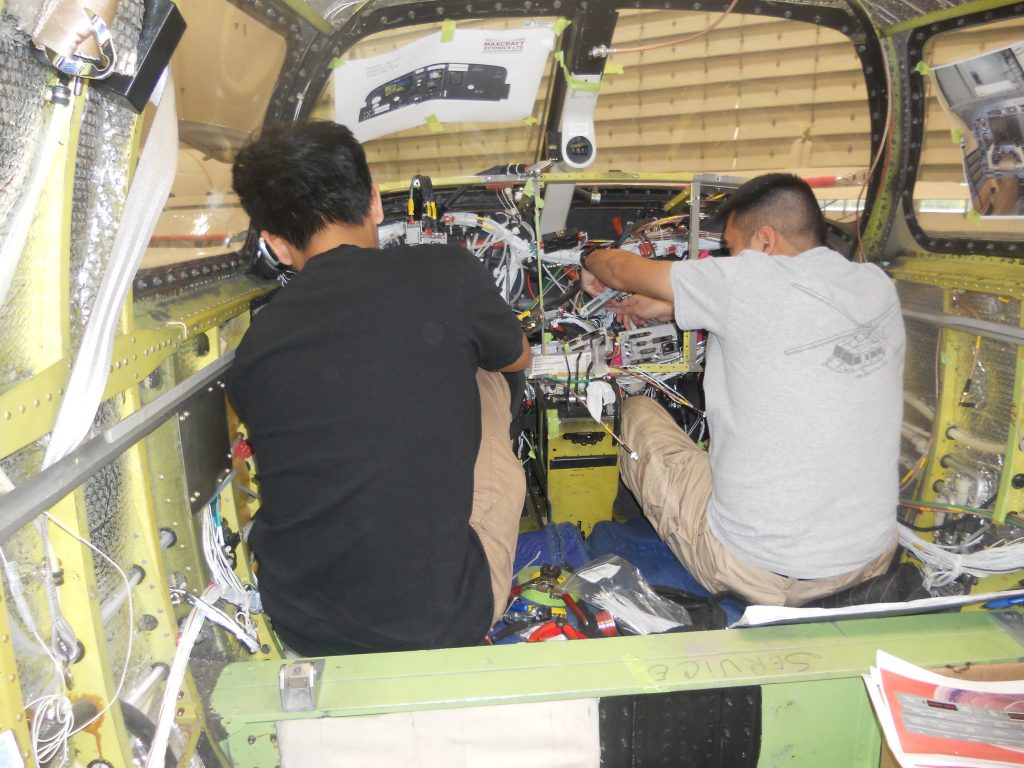 Maxcraft Technicians Routing Wiring Throughout the Aircraft