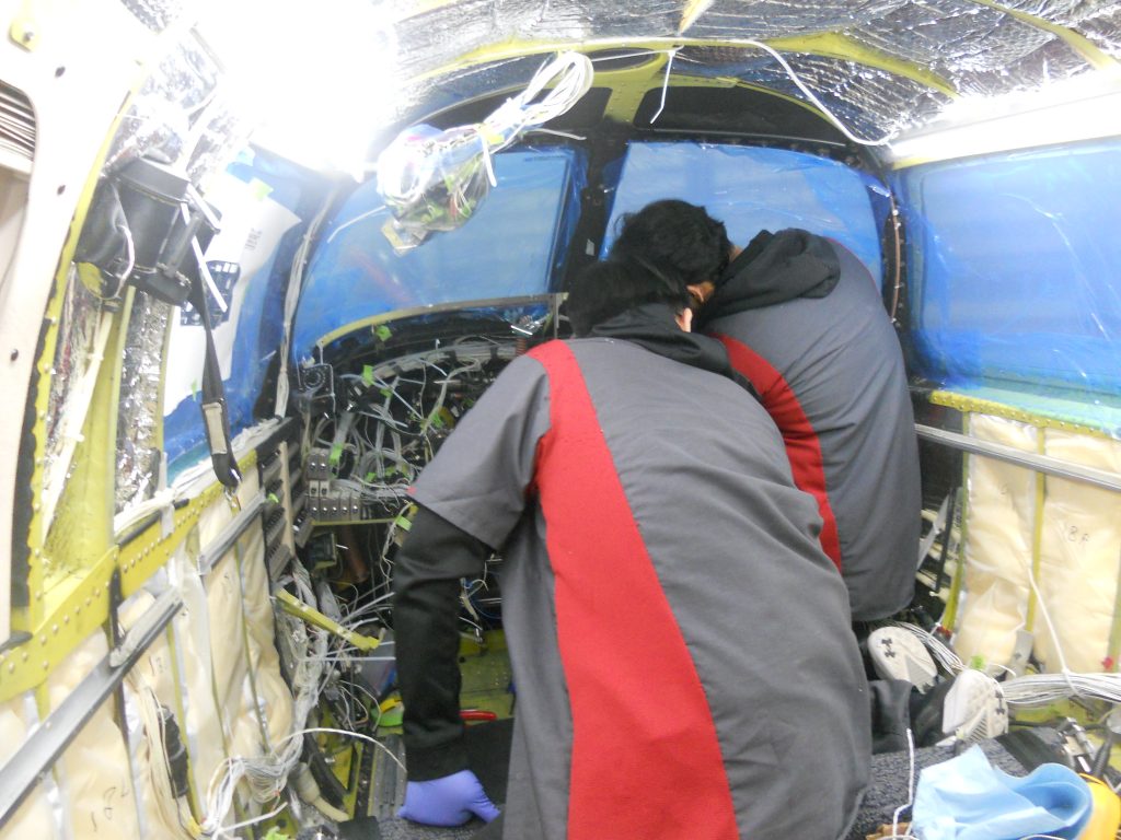 Maxcraft Technicians Routing Wiring Behind the Instrument Panel