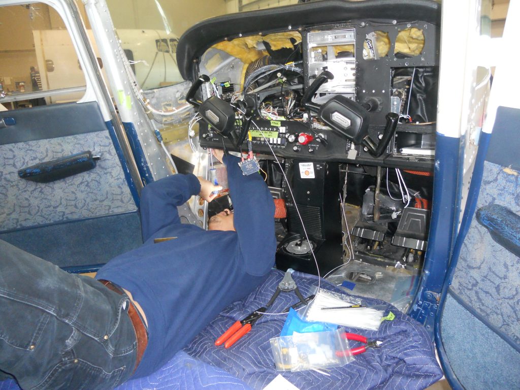 Maxcraft Technician Routing Wiring Under the Instrument Panel