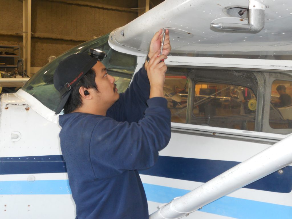 Maxcraft Technician Reinstalling an Access Cover