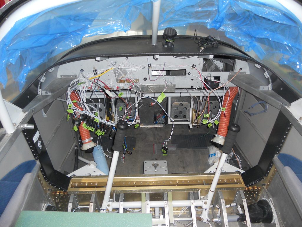 The Gutted Panel with Everything but a Handful of Wires and Switches Remaining